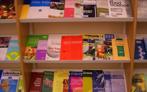 Photo of journals on a bookshelf