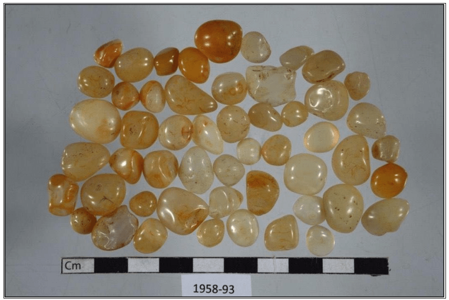 A collection of yellow and white quartz stones from an Icelandic pagan grave