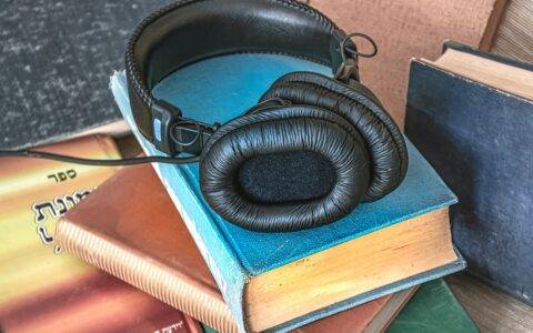 Picture of headphones on a stack of books