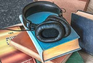 Picture of headphones on a stack of books