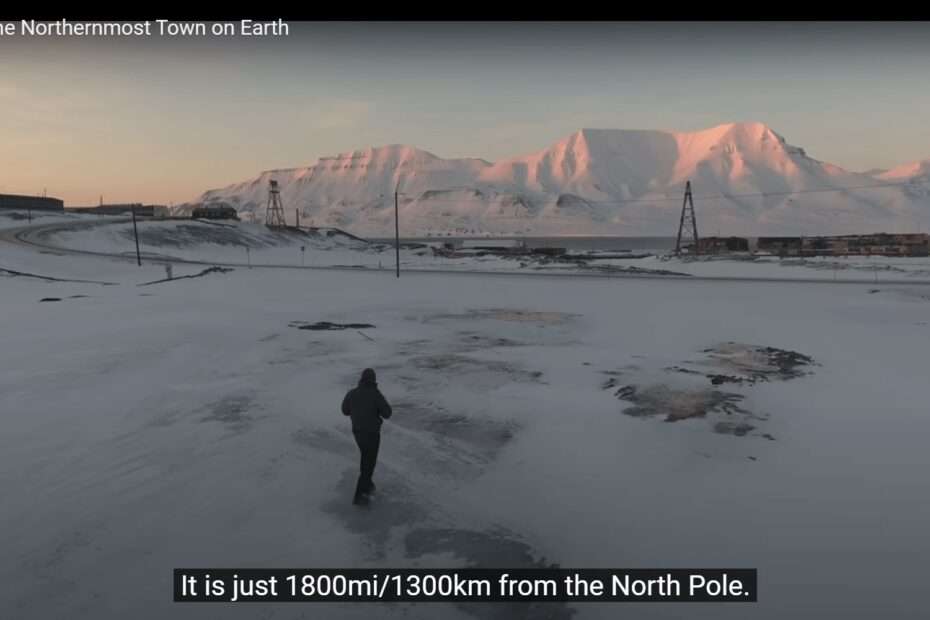 Screenshot showing a person standing alone in an icy landscape with snow covered hills
